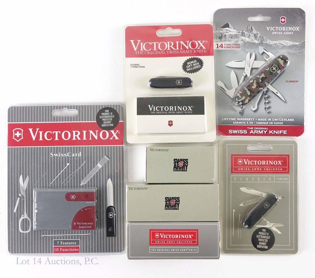 Victorinox Swiss Army Knife and Tool Lot: All new old stock. Rainier Serrated #53221, White Huntsman, Classic 7 Function (x3), Climber (Camo), and Swiss Card.