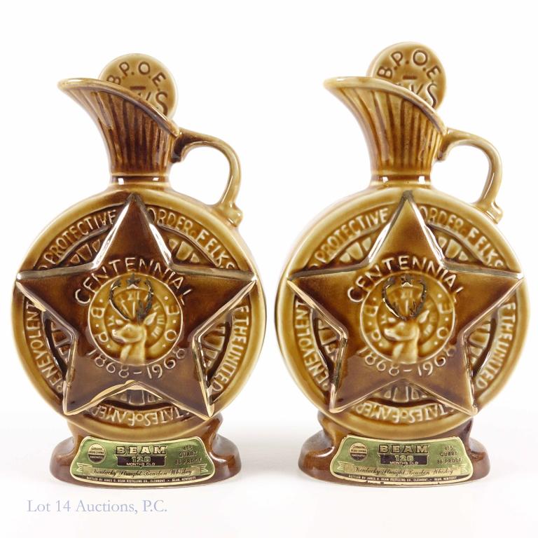 Beam's Elks Club Whiskey Decanters (2): *** IF YOU MAY NEED SHIPPING YOU MUST SPEAK WITH IAN BEFORE BIDDING ON BOTTLES*** 2 Beam's Bourbon Whiskey decanters celebrating the Elk's Club. 86 proof. 4/5 quart. 120 months. Full & sealed.