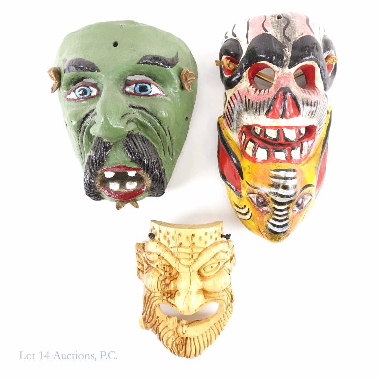 Mexican Painted Wooden Masks: Green creature w/ mustache and teeth, 8 1/2" x 7". Lightwood carved mask, bearded man, unpainted, 8 1/2 x 7". Painted skeleton with creature (red, orange, black and white), 10 5/8 x 5 3/4".