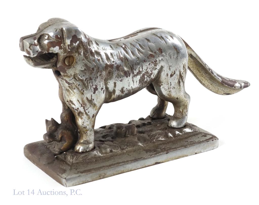 Vintage Cast Iron Dog Nutcracker: - Cast iron w/ polished nickel surface dog w/ squirrel holding nuts nutcracker. - Dog could be Saint Bernard or Newfoundland - Weight: 5 lbs. 12 oz. - L: 13" W: 3 1/2"
