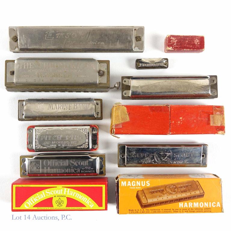 Harmonica Assortment (8): 1947 Magnus no. 80. In box. Star Band. Made in Germany. In box. Official Scout. In box. Mini Little Bandmaster. In box. Emson. No box. M. Hohner The "Chromonica." No box. M. Hohner Marine Band. No box