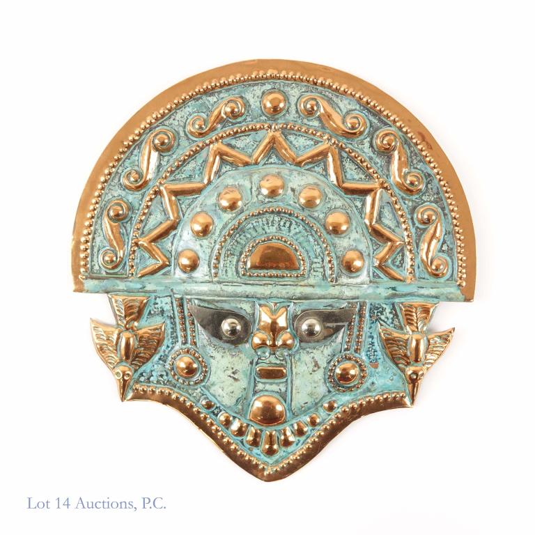 Aztec Metal Mask: Metal mask in an Aztec style. We cannot tell if the metal is tin, copper, bronze, or some other metal entirely. Approximately 7-3/4 x 8".