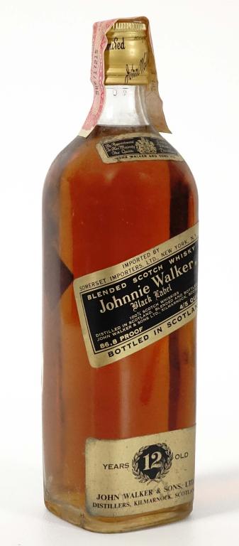 Johnnie Walker Black Lbl. Scotch (4/5 Qt. 86.8 Pr): IF YOU MAY NEED SHIPPING YOU MUST SPEAK WITH IAN BEFORE BIDDING ON BOTTLES. 847-625-0555. Vintage 12 year old Johnnie Walker Black Label Blended Scotch Whisky. Full and sealed.
