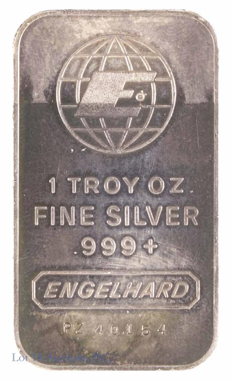 Engelhard 1ozt Silver Bar (Vintage and Toned): 1 troy ounce of 0.999(+) fine silver from Engelhard. This bar shows both obverse and reverse toning with the obverse showing subtle blues and violets and the reverse showing blues and greens.