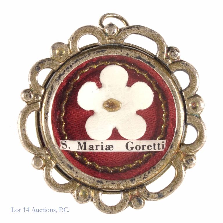 Saint Maria Goretti Reliquary with Catholic Relic: Saint Maria Goretti Reliquary. White metal theca with wax seal and threads intact. Saint Maria Goretti was the youngest saint in the history of the Catholic Church - murdered at age 11 but not before 