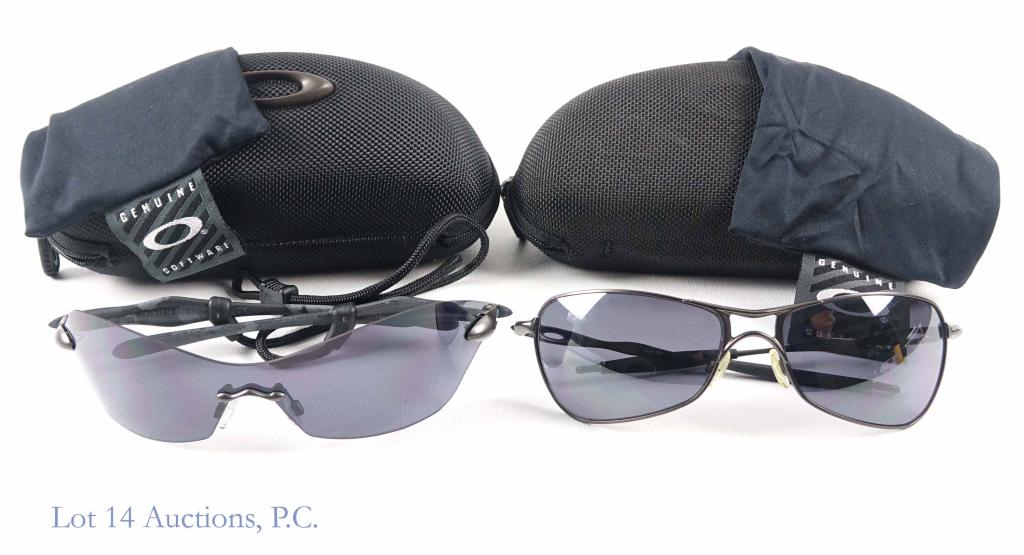 Oakley Sunglasses (2): Oakley "Crosshair" sunglasses. No strap. In dust bag and case. Appear to be in good condition. Oakley frameless sunglasses with black strap. In dust bag and case. Appear to be in good condition.