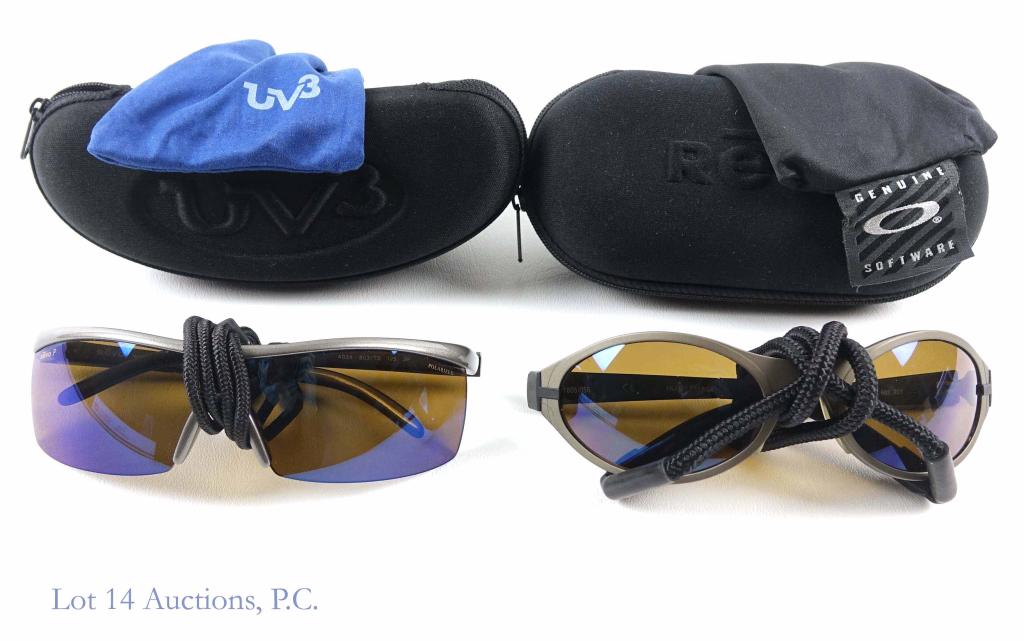 Revo Sunglasses (2): Revo Polarized sunglasses 4034 (grey) with black strap. In dust bag and case. Appear to be in good condition. Revo 18051055 sunglasses (grey) with black strap. In dust bag and case. Appear to be in go
