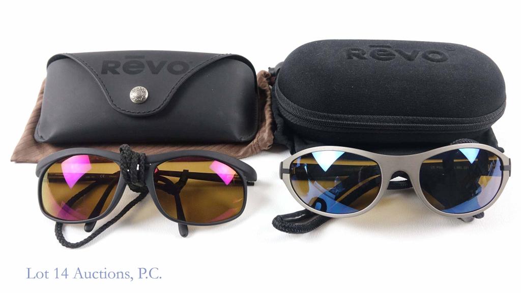 Revo Sunglasses (2): Revo 18041055 sunglasses (grey) with black strap. In dust bag and case. Appear to be in good condition. Revo 1006-001 sunglasses (black) with black rope strap. In dust bag and case. Appear to be in go