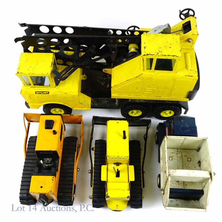 Tonka and Nylint Trucks (5): Vintage 70's Nylint Michigan Crane Truck- with Tonka crane clam shell bucket, Tonka metal bulldozer / plow (plow lever still works)- has rusting and paint chipping, Tonka T-6 Bulldozer pressed steel (