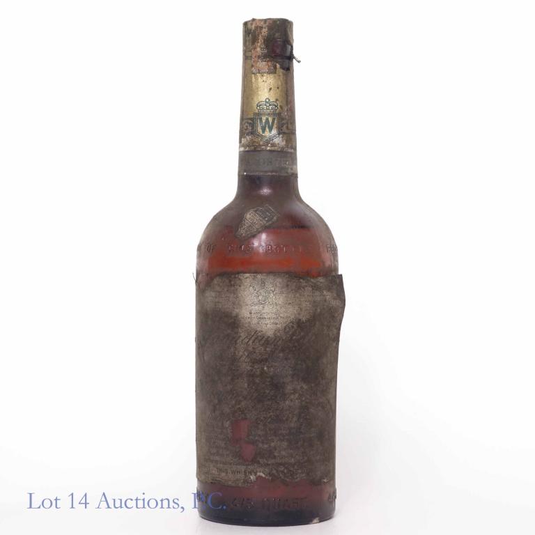 1948 Canadian Club Whisky: **IF YOU NEED SHIPPING ON BOTTLES OR DECANTERS PLEASE CALL US BEFORE BIDDING! 847-625-0555!** 90.4 proof, 4/5 qt and sealed. Label is missing / torn in places. Embossed: Federal Law Forbids. . .6 year