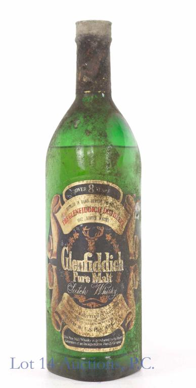 Glenfiddich Pure Malt Scotch Whisky: **IF YOU NEED SHIPPING ON BOTTLES OR DECANTERS PLEASE CALL US BEFORE BIDDING! 847-625-0555!** 86 proof, 1 liter, sealed. Over 8 years. "SC 787" embossed on bottom of bottle. Came out of the basement o