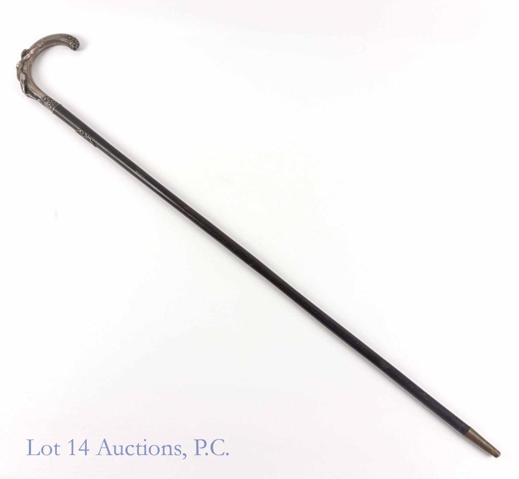 Walking Cane with Polish Sterling Silver Nude Handle: Walking cane (3' long). The handle is hallmarked (800 silver, made in Warsaw, Poland, 1931 - 1963). The handle also has a nude woman seductively reclining across the handle. There is denting to the fi