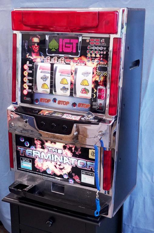 2000 The Terminator Pachislo Slot Machine & Table: By Jasrac, IGT, Japan. Missing plastic knob, but threaded post is intact. Works with tokens (some included, but you'll want to buy more). Appears to be fully functional. Key included. Made in Japan. P