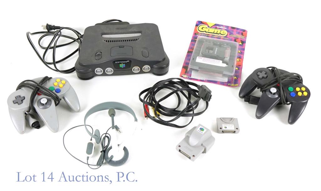Nintendo 64 w/ Controllers: Nintendo 64 game system with the power cord and RCA TV wires. Also included is 2 controllers, one controller pak ,one rumble pak and a 1996 Nintendo 64 Cleaning Kit by Performance in the box (never op