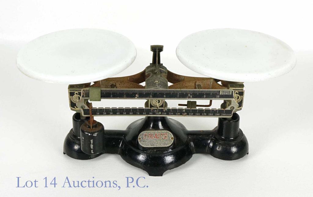OHaus 2 Kilo Cast Iron Scale / Balance Milk Glass: Milk glass in very good condition - some very small chips on bottom rim. Scale has rubber stops below the pedestals immobilizing it when not in use. Seems to work correctly, but untested for accuracy.