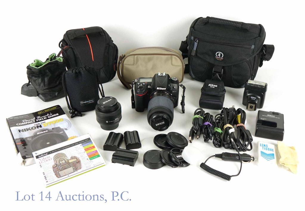 Nikon D7000 D-SLR & 2 Lenses: Nikon D7000 (16.2MP CMOS sensor, 1080p HD video, ISO 100-6400, twin SD card slots, 3" LCD screen, 6fps continuous shooting... Just read the reviews!) with 3 3 batteries, charger, video cords, lens and