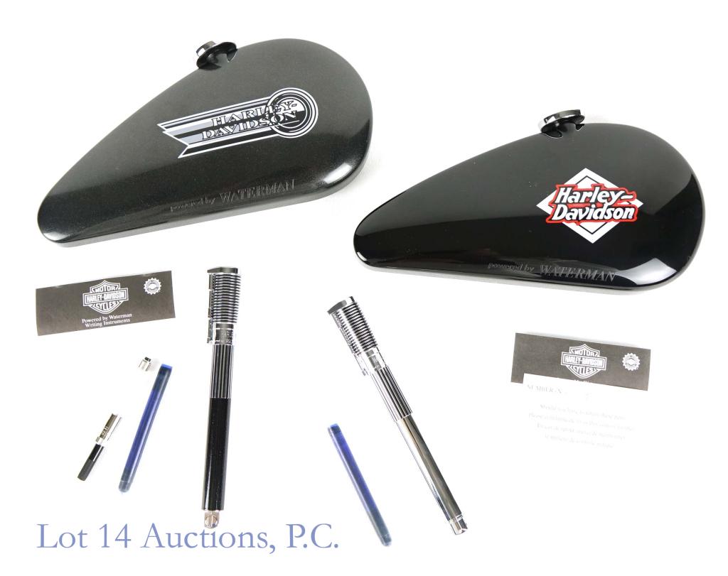 Harley Davidson Waterman Fountain Pens (2): 2 Waterman fountain pens with the Harley Davidson logo and their original gas tank design presentation case. Both pens are in like new condition and neither appears to have ever been inked. Another ni