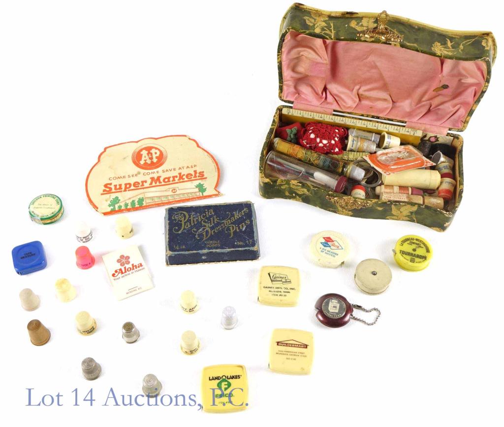 Celluloid Sewing Box & Sewing Materials: Celluloid sewing box with collection of sewing materials. Approximately 9.25 x 5.25 x 2.75". Some signs of wear, including damage to the front rim and corner of the lid.