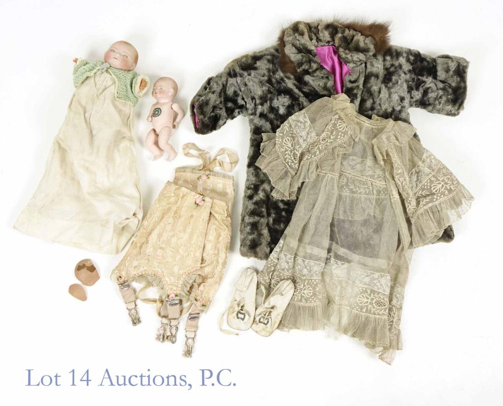 Bye-Lo Bisque Porcelain Baby Dolls (2) + Clothes: Lot of two bisque porcelain dolls + some clothing: 1. Bye-Lo Baby by G.S. Putnam (Germany). Intact, no chips, some stains. No clothes. 6" tall. 2. Unknown brand (possibly Bye-Lo as well), porcelain he