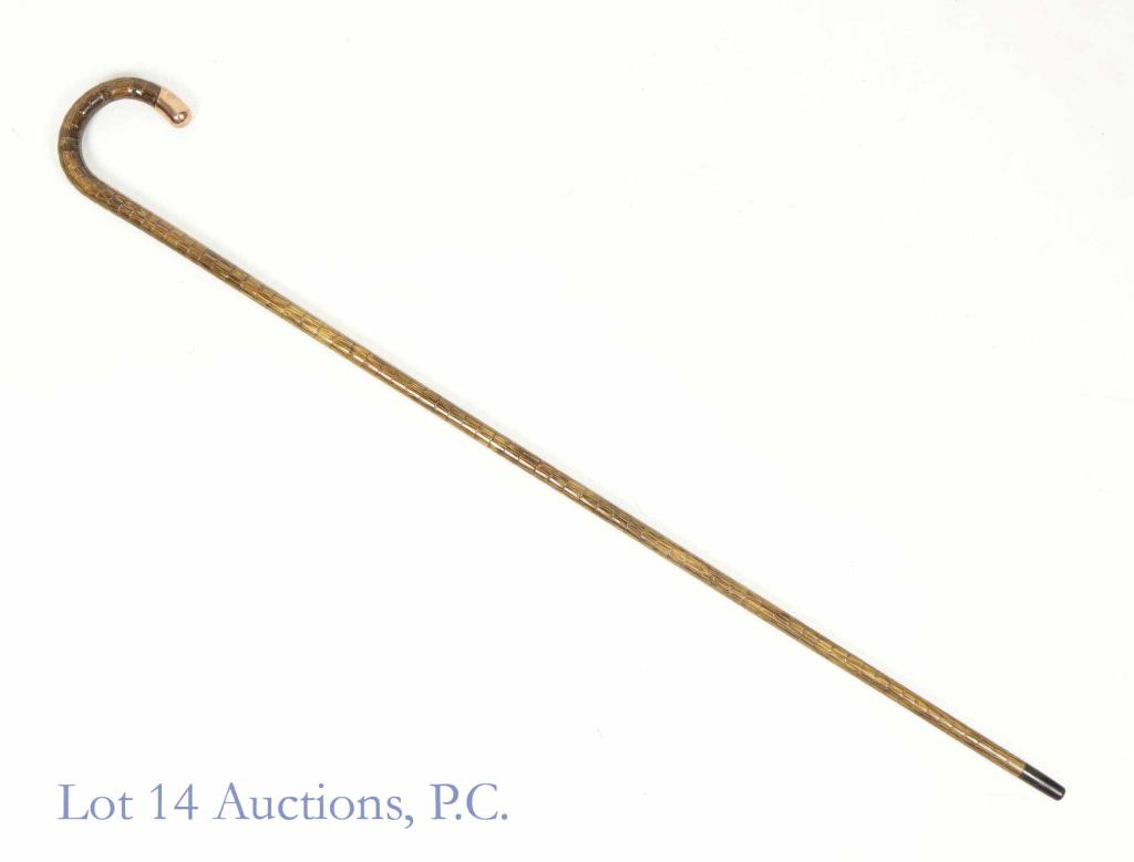 10 - 18k Gold Cap English Cane 1904: Walking cane with a rose gold cap. The cap is engraved with the words "Porter M. Smith, Chicago, 1904". It has other hallmarks but they are faded and illegible. 35.5" tall. Some minimal chips on handl