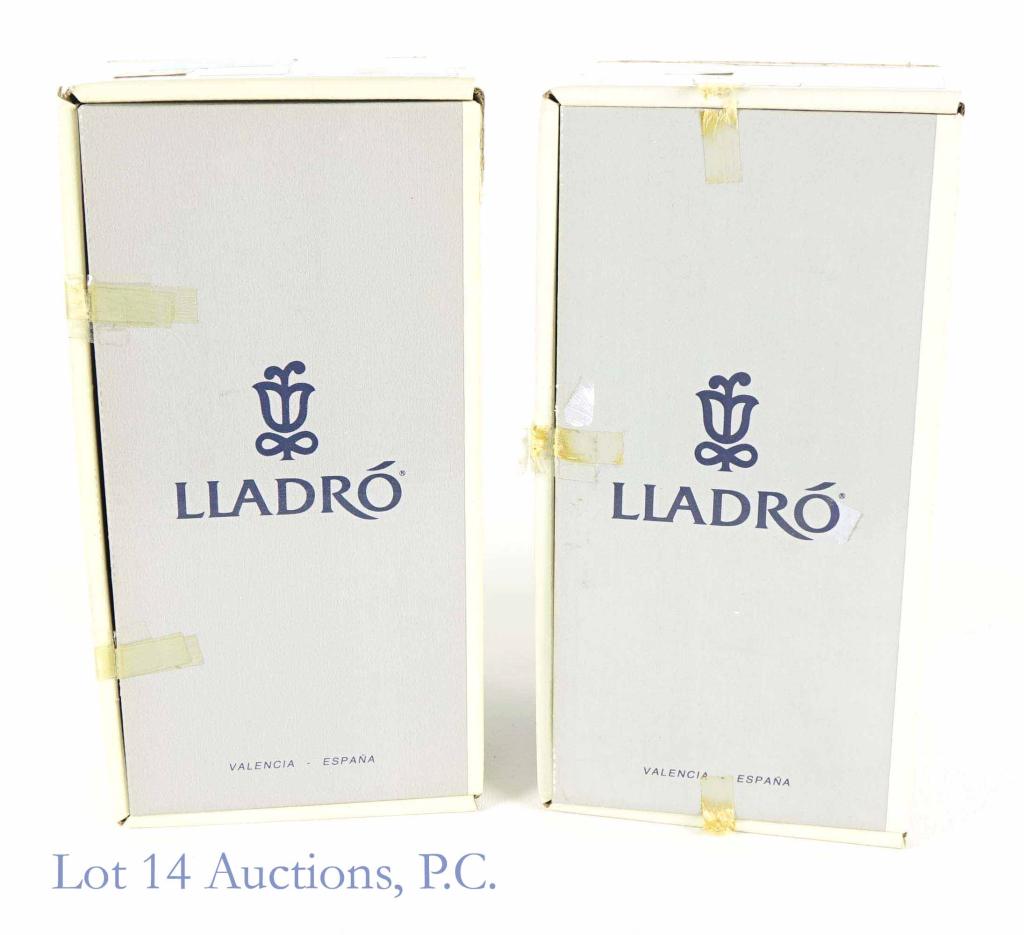 Lladro Figurines - Girls with Closed Umbrellas (2): Lot of 2 Lladro figurines featuring girls holding closed umbrellas. 1. "Garden Song", No. 7618. 2. "Summer Stroll", No. 7611. Both in original box. No chips, repairs, damage or scratches on any piece.
