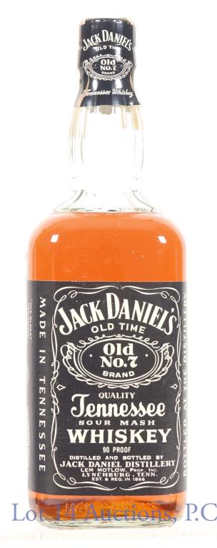 Jack Daniel's Sour Mash Whiskey Series 112: Jack Daniel's Sour Mash Tennessee Whiskey. Series 112 tax strip indicates that it is from 1960s or 1970s. 90 proof. 4/5 quart. Sealed, slightly lower fill (between shoulder and neck base). Seal, tax s