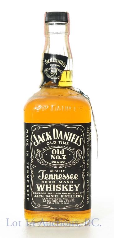 1981 Jack Daniel's Tennessee Whiskey: Jack Daniel's old no. 7 sour mash Tennessee Whiskey. Tax strip series 112 - Bureau of ATF, 90 proof, 750 ml.. Cello is loose, comes with original tag.