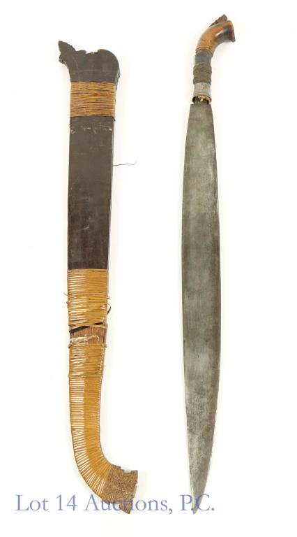 Philippine Moro Barong Knife / Sword As Is: Philippine Moro Barong Knife or Sword. A short sword with wood hilt and scabbard. Scabbard is in 2 pieces and wrap is coming off of scabbard. Hilt will detach from sword. Blade is approx. 19.75". Swor