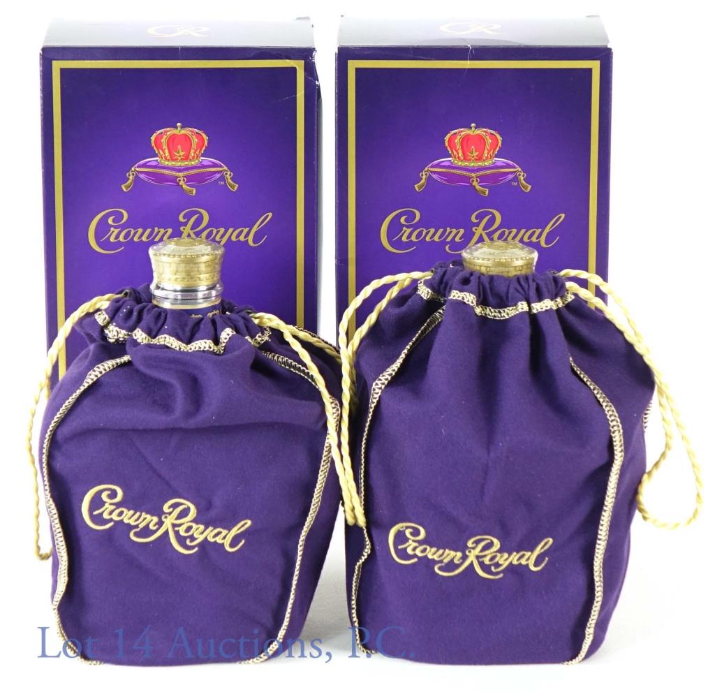 Crown Royal Canadian Whisky (2): (2) bottles of Crown Royal blended Canadian whisky. 80 proof. 750 ml. Each bottle has a purple drawstring bag and (rougher condition) original box.