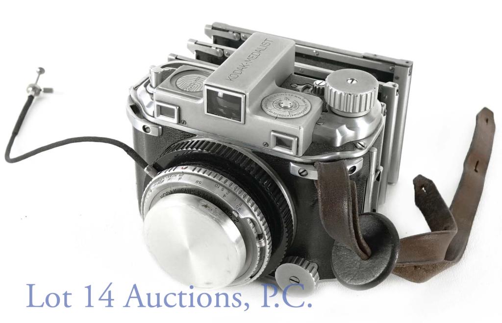 Kodak Medalist Medium Format Rangefinder Camera: 1945 Kodak-Medalist Medium Format camera, uses 620 film. With two Kodak Extension units. 100mm f 3.5 E.R. 2700 Kodak Ektar lens, lens S/N ER2700 (1945). Camera S/N 22381. With lens cap. Untested, but 