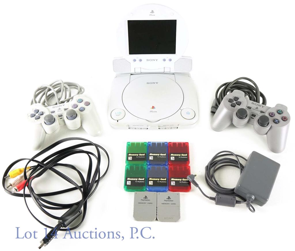Sony Playstation PSOne Video Game System: Sony PS One video game system with built in travel screen. Includes: system, adapter, (2) controllers, TV connector cords, (8) Play Station memory cards.