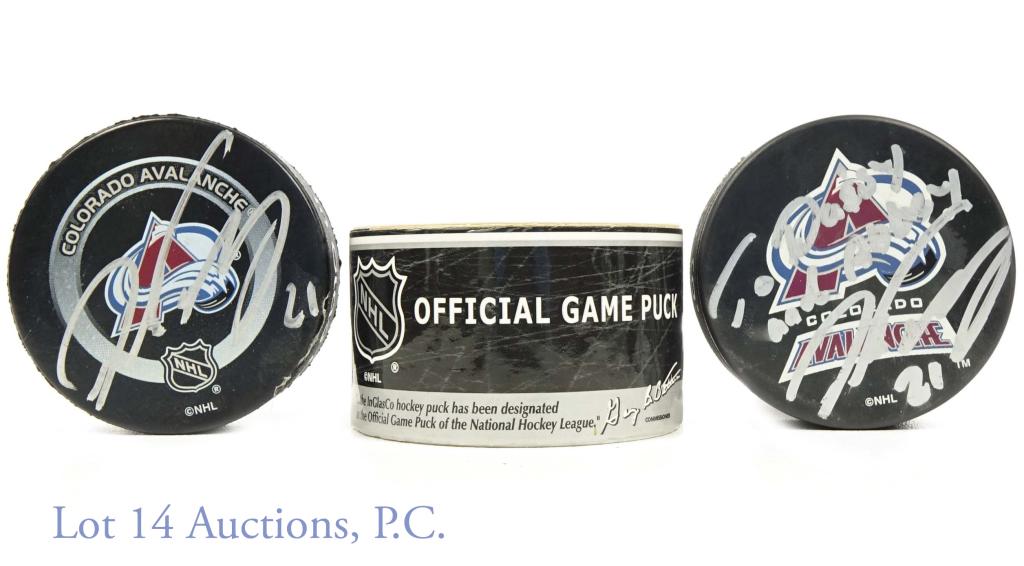Signed Hockey Pucks - 2 Peter Forsberg: Two hockey pucks signed by Avalanche Hockey player Peter Forsberg. One puck is personalized above the autograph. The other is autographed with his number 21 and in a small game puck canister.