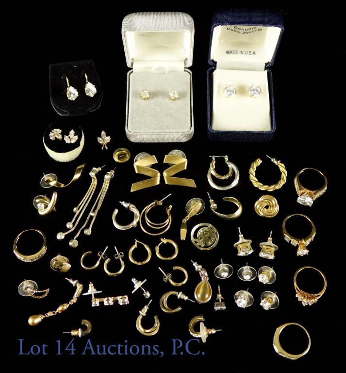 Cubic Zirconia Gold Plated Jewelry: Lot of various gold plated and cubic zirconia jewelry. Includes at least 7 pairs of earrings, 5 rings and one pendant. Includes pair of Monet earrings. Some earrings (not counted) are missing their pa