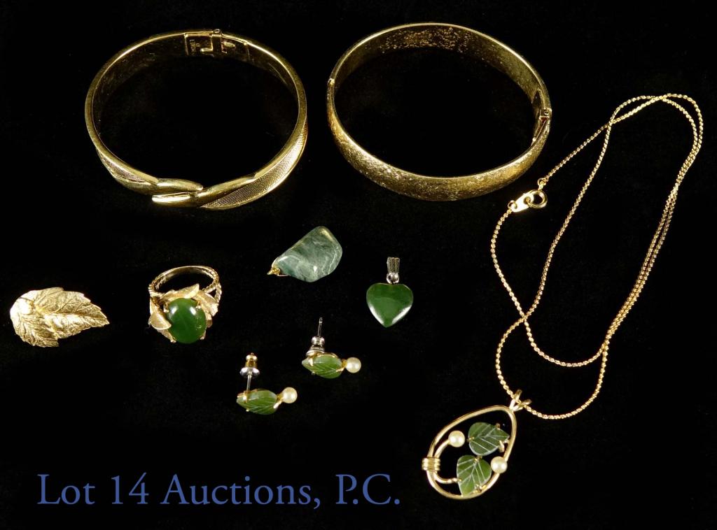 Jade and Gold Toned Jewelry Monet: Gold toned and jade ring, size 5.5. 2 Monet bangles, and 1, single, Givenchy earring. Lot also includes more two jade pendants and 1 pair of earrings and matching necklace (not gold).