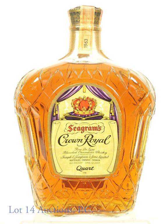 1963 Crown Royal Canadian Whisky: Crown Royal blended Canadian whisky. 1963. 80 proof, 750 ml. Full and sealed. still has plastic seal over cap and strips. Discoloration on back label.
