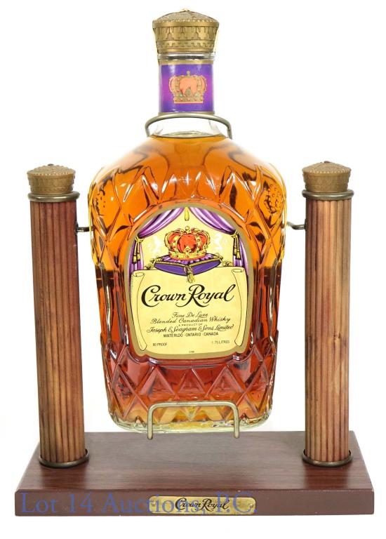 681975 Crown Royal Canadian Whisky (1.75 L): *** IF YOU MAY NEED SHIPPING, PLEASE CALL US BEFORE BIDDING ON BOTTLES! 847-625-0555. *** Crown Royal blended Canadian whisky. 1975, 80 proof, 1.75L). Comes with original pouring cradle.