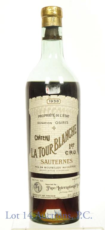 1938 Chateau la Tour Blanche Sauternes: Vintage 1938 sweet French table wine. 1er Cru. 12% abv. 750 ml. Import by Pape International Inc. Sticker residue above and below label. Capsule damage. No leakage when overturned.