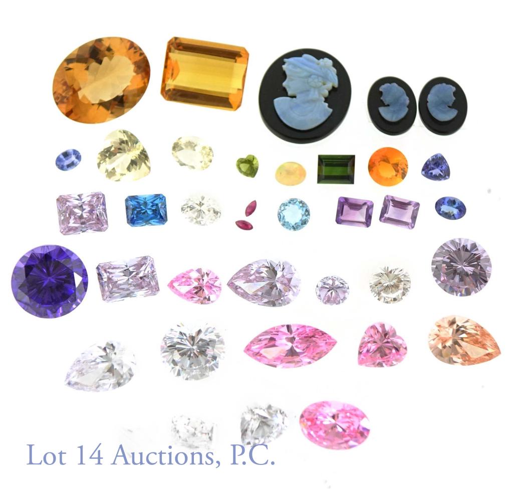 Loose Gemstones and Glass Stones (37): Huge lot of loose stones (37). Includes 2 orange citrine: 26mm oval and 22mm rectangle. 2, 9mm rectangle purple amethysts. 2, 5x3.5mm rubies. 1, 8mm, round, blue topaz. 1, 10x8mm, blue iolite rectangl