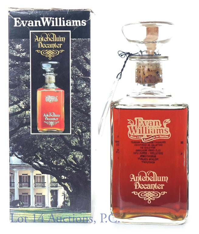 1985 Evan Williams Antebellum Decanter: Evan Williams Kentucky straight bourbon whiskey. 7 years old. 90 proof, 750ml. 85 embossed on bottom of bottle. Neck tag present. No leaking. Comes with original box.