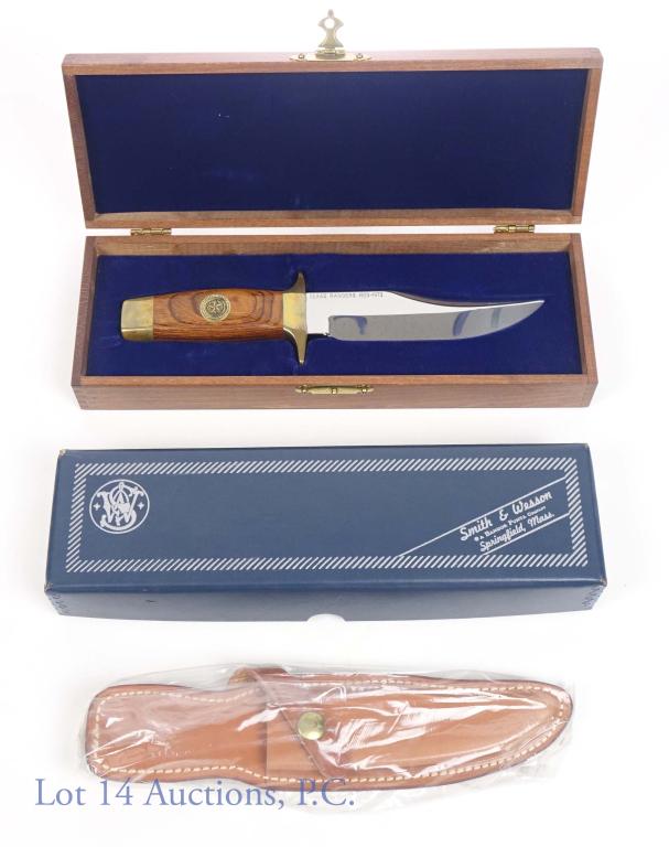 1973 Texas Rangers S&W Knife, Case, Box, Sheath: Blackie Collins designed Smith & Wesson Texas Rangers Bowie style knife. Matching number original box (TR17878) and Knife (NOS). Wood presentation case and leather sheath. 5.75" blade, 10.25" overall
