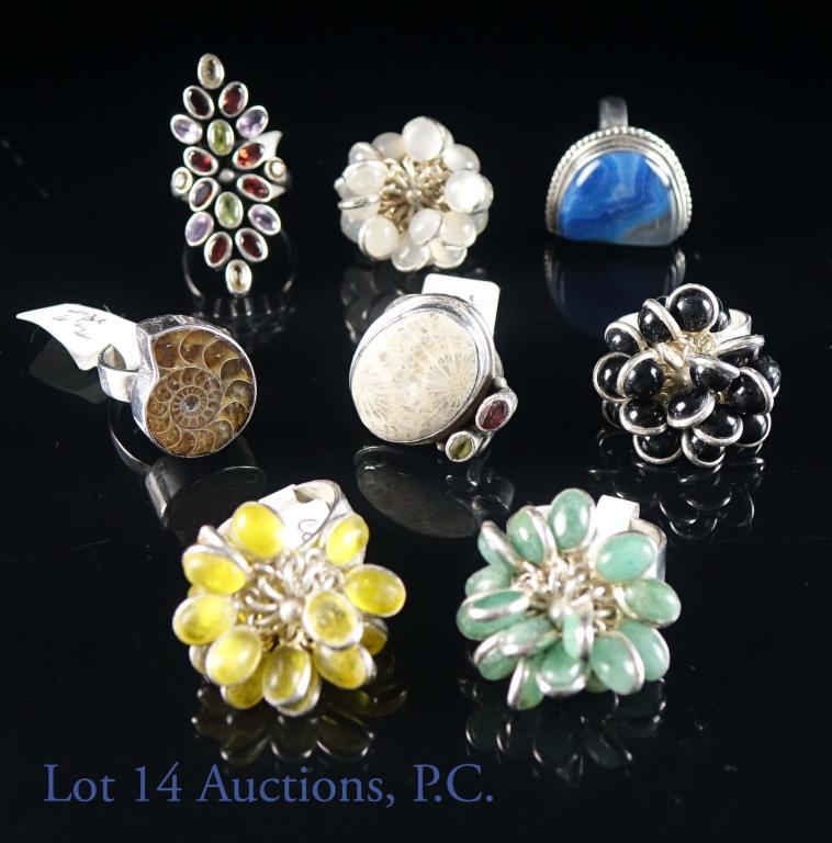 Sterling Silver and Gemstone Rings (8): Eight sterling silver and gemstone rings. All marked 925. Some stones featured are onyx, jade, citrine, blue agate, fossil and more. Sizes 6-8. Total weight: 80 grams.