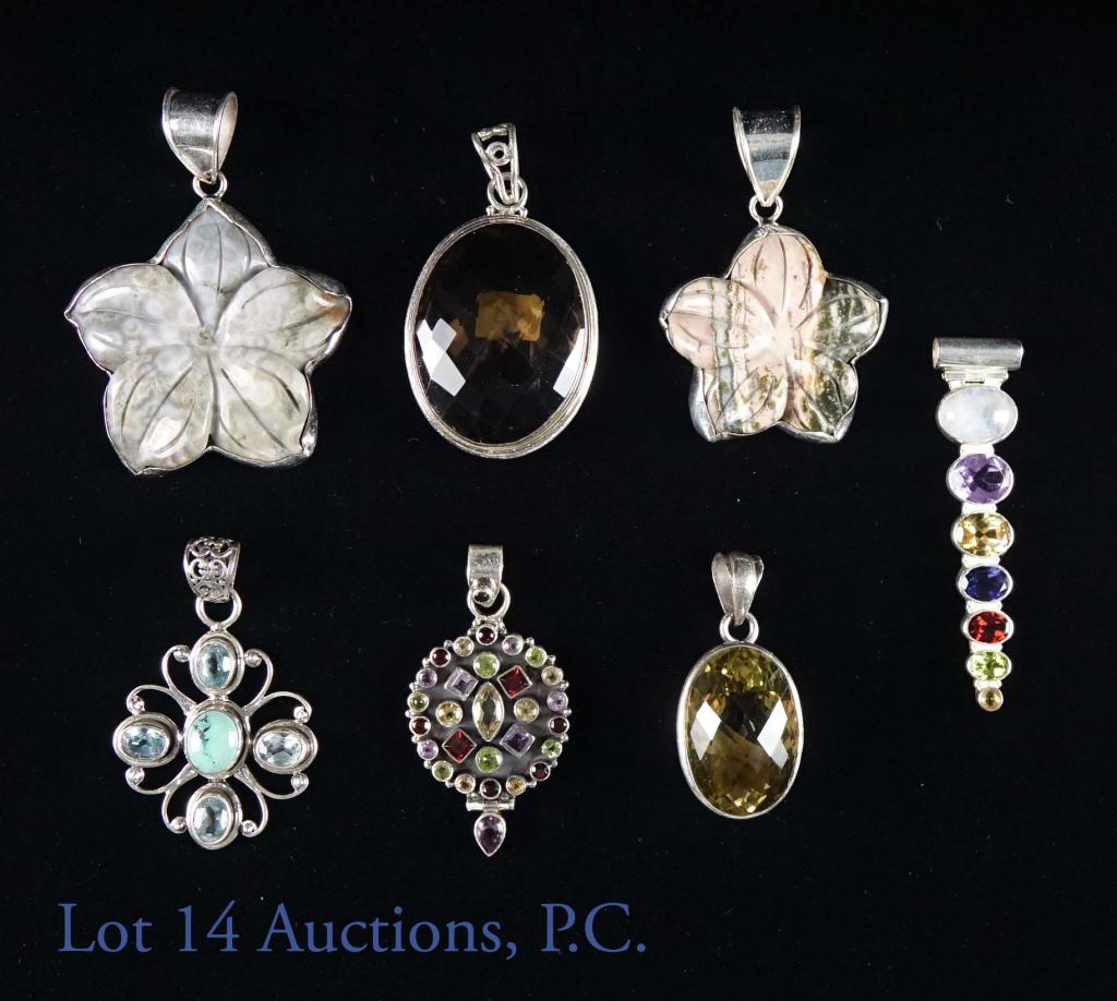 Sterling Silver and Gemstone Pendants (7): Sever sterling and gemstone pendants. Some stones included are yellow labradorite, smokey quartz, opal and more. Lengths range from 1.25-3". total weight: 136 grams.