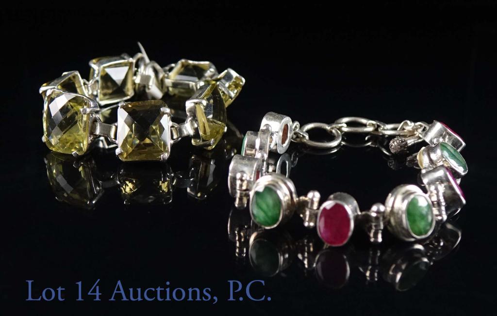 Sterling Silver and Gemstone Bracelets (2): Pair of sterling and gemstone bracelets. Both marked 925. One features yellow labradorite stone, while the other features green (likely emerald) and red / pink stones. Lengths: 8". Total weight: 65 gr