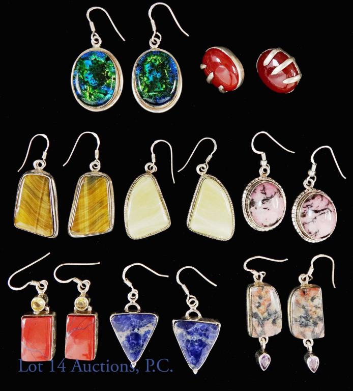 Sterling Silver and Stone Earrings (8) Rhodonite +: 8 pairs of sterling silver and gemstone earrings. Stones include: tiger's eye, rhodonite, red jasper, lapis, opal and more. Stones measure less tan 1 inch. Total weight: 95 grams.