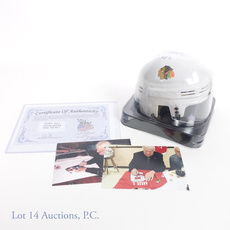 Bobby Hull Signed Mini NHL Helmet (COA): Blackhawks mini helmet signed by Bobby Hull. Has COA. Bobby Hull inscribed #9, HOF 1983. Comes with 2 photos of Bobby Hull at a signing event.
