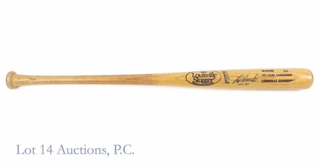 Lou Brock Signed Baseball Bat: Lou Brock Signed Bat. Louisville Slugger D2 St. Louis Cardinals model baseball bat. Inscribed "HOF '85" below the autograph. Measures at 33-3/4" long. Very light cracking away from signature on barrel