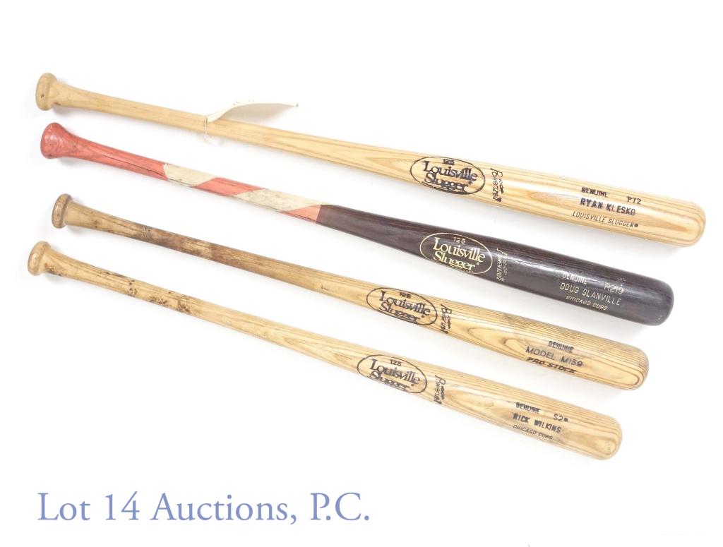 Chicago Cubs Baseball Bat Collection: Louisville Slugger S2 "Rick Wilkins Chicago Cubs" model bat. There is a piece of wood missing near the place where the handle and barrel meet. Wear and staining consistent with use. "2" / "52" is writ