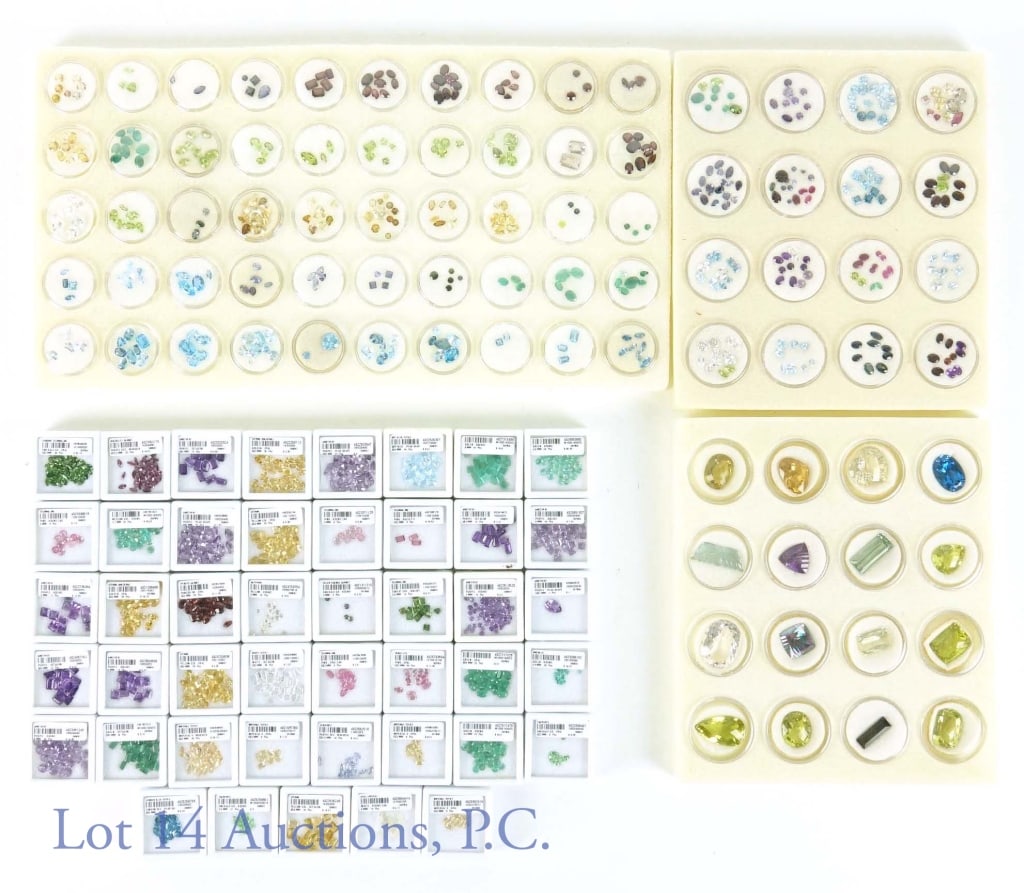 Large Gemstone Lot: Large lot of gemstones. Some gems included among others: citrine, imperial topaz, opal crystal, amethyst, tsavorite, emerald, tourmaline, and more. Come in varying shapes and sizes. In circular and re