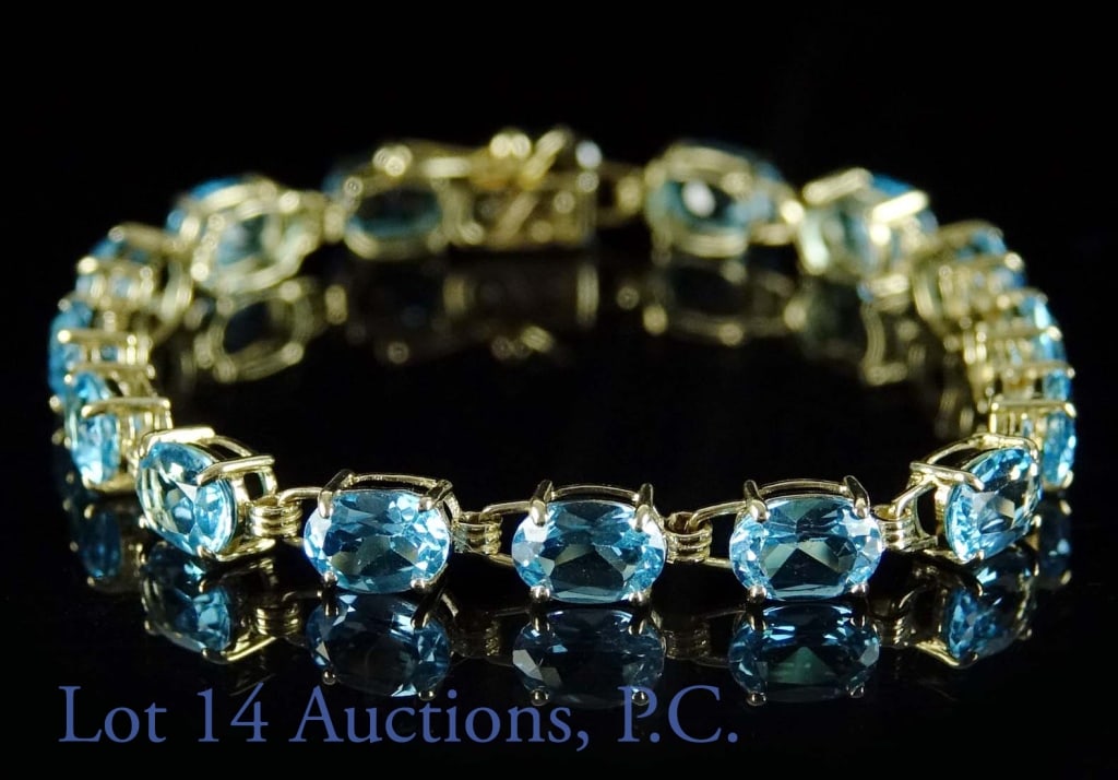 10K Yellow Gold 16X Synthetic Blue Gems Bracelet: 10K Yellow Gold 16X Synthetic Blue Bracelet. 6 1/4" in length. 7.3 g.