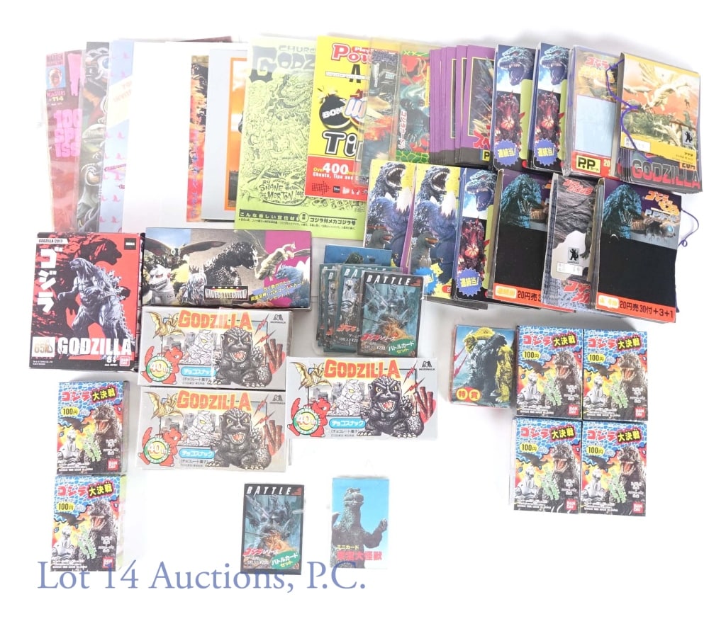 Godzilla Collectibles From Japan: Collection of Godzilla collectibles that all appear to be from Japan. There are some (still sealed) candy and cookies. A copy of the "Church of Godzilla" publication. Some of the other packaging appea